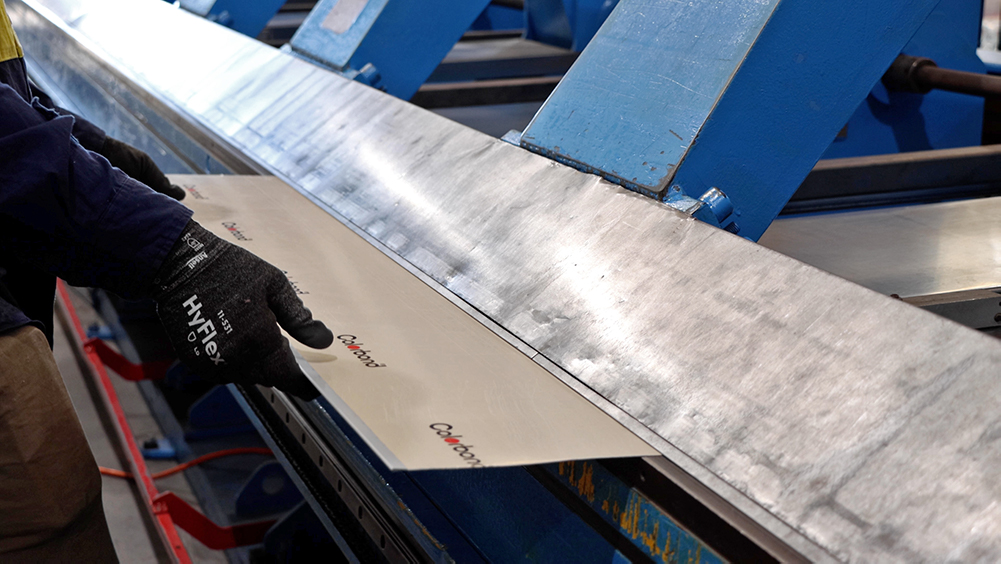 Colorbond steel being bent in a machine