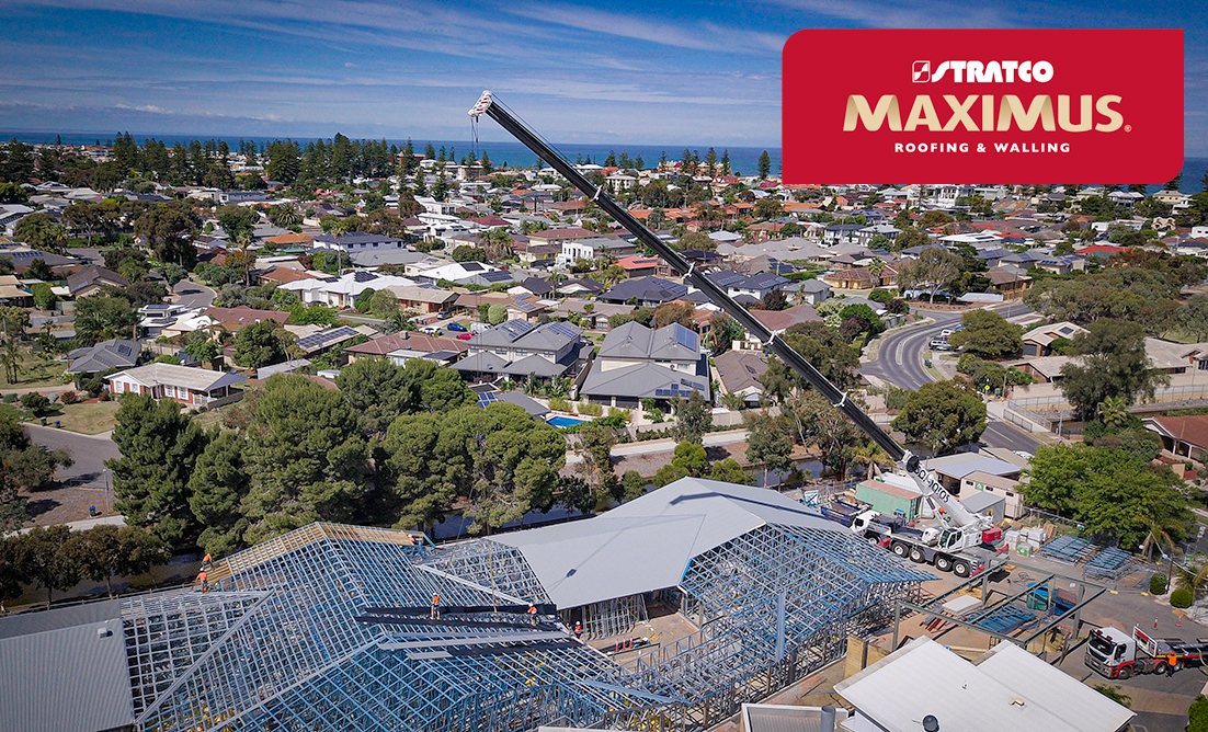 Crane lowering Maximus Roofing onto X-1 Framing